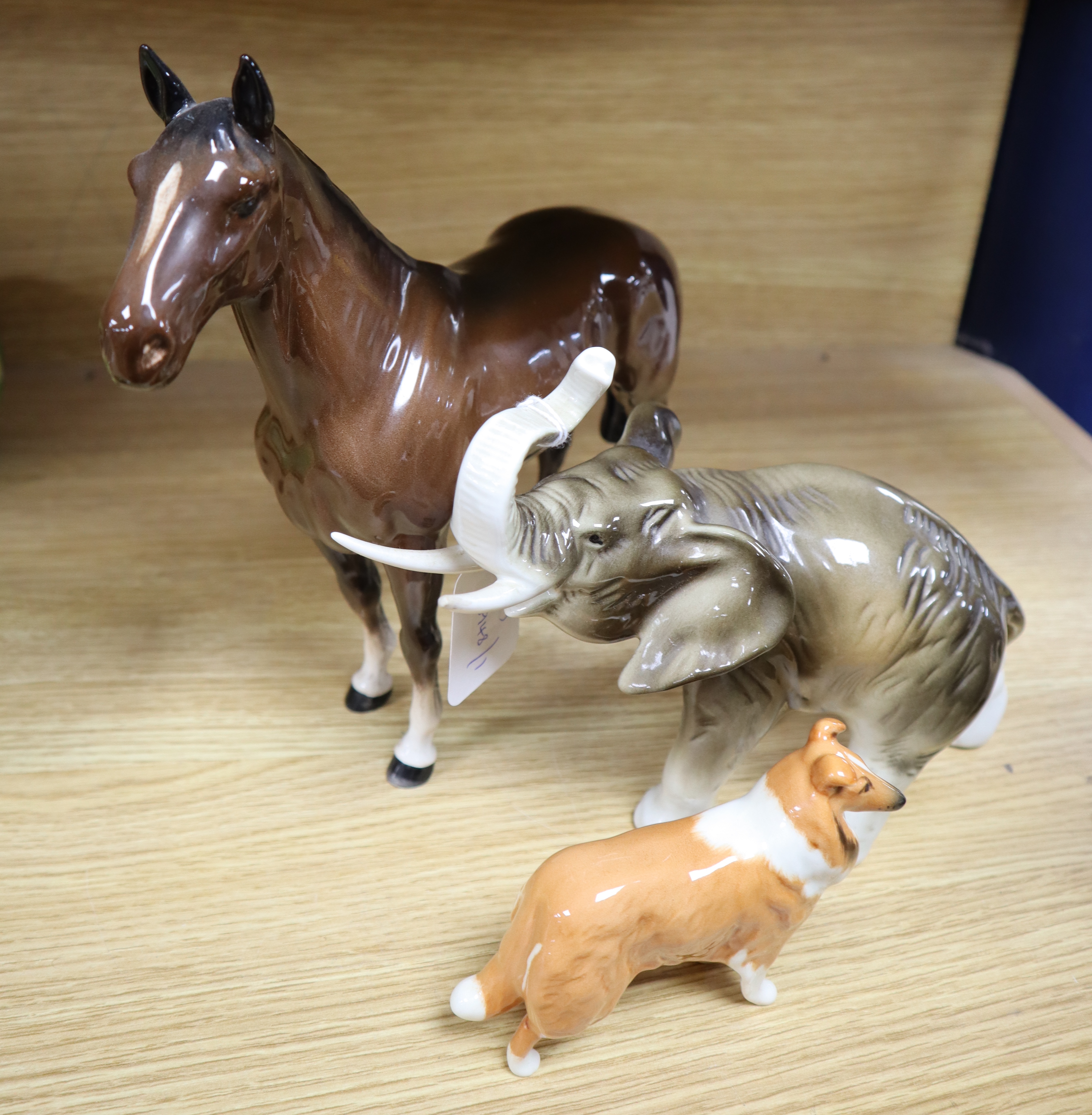 A Beswick porcelain racehorse The Winner, a Beswick collie and a Royal Dux elephant, largest 24 x 23cm
